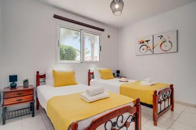 a bedroom with two beds and a window at Apartment Helena in Ayia Napa