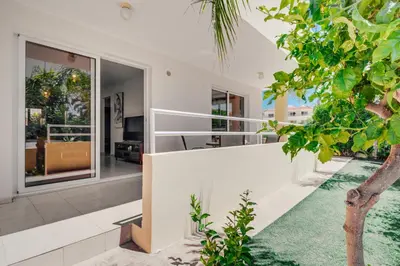 an external view of a house with a garden at Apartment Helena in Ayia Napa