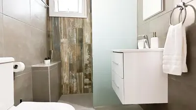 a bathroom with a toilet and a sink and a shower at Vacation mode Apartment in Ayia Napa