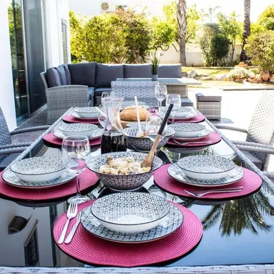 a table with plates and bowls of food on it at Villa Artemis in Larnaka