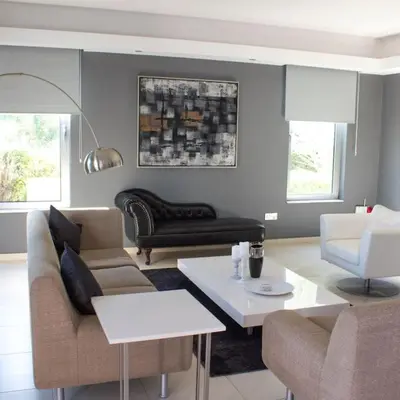 a living room with couches and a coffee table at Villa Artemis in Larnaka