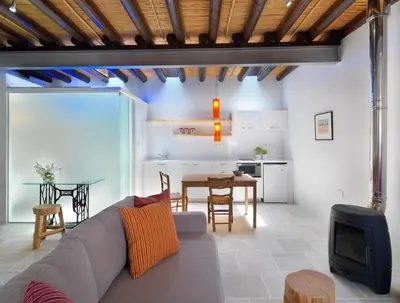 a living room with a couch and a table at Palatakia - Adults Only in Kato Drys
