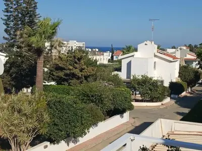 a view from the roof of a house with trees and bushes at Protaras Fig Tree Bay Sea View Villa , Jacuzzi Available April to October in Protaras
