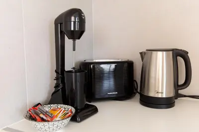 a coffee maker and a coffeemaker on a counter at Nelia Panorama Villa in Protaras