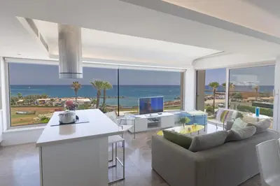 a living room with a view of the ocean at Protaras Thalassa Apartment Ta206 in Protaras