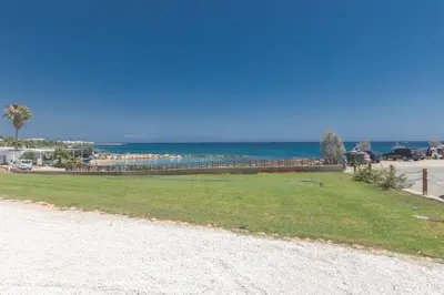 a park with the ocean in the background at Protaras Thalassa Apartment Ta206 in Protaras