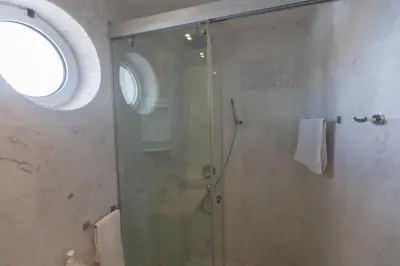 a bathroom with a shower with a glass door at Protaras Thalassa Apartment Ta206 in Protaras