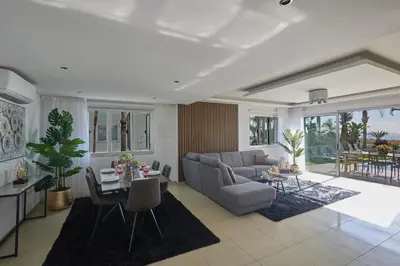 a living room with a couch and a table at Sunrise Villa 9 in Ayia Napa