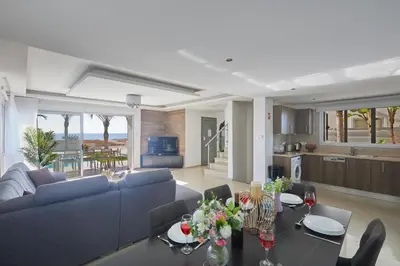 a living room with a couch and a table at Sunrise Villa 9 in Ayia Napa