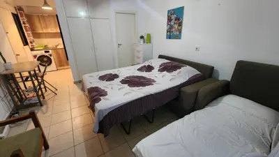 a small room with a bed and a couch at Ayia Napa Cyprus in Paralimni