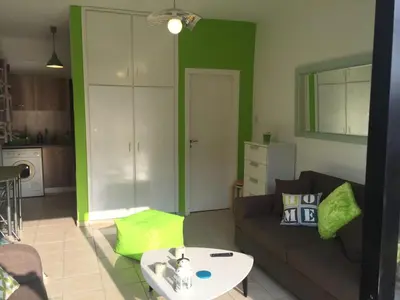 a living room with a couch and a table at Ayia Napa Cyprus in Paralimni
