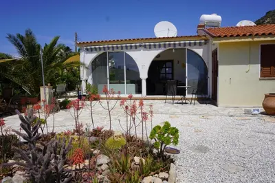 a house with a garden in front of it at Villa Hanna mit Meerblick in Pissouri