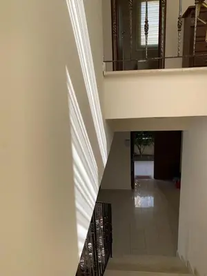 a hallway with a staircase in a house at Villa 28 Protaras in Protaras