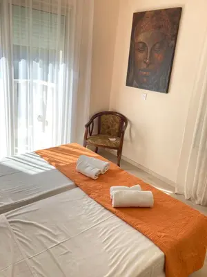a bedroom with a bed with two towels on it at Anna Villa in Protaras