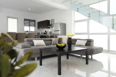 a living room with a couch and a table at Villa Selena in Protaras