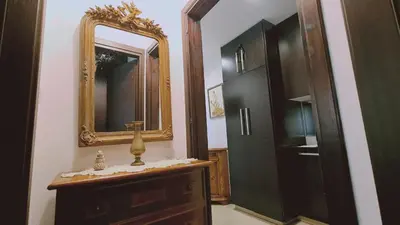 a bathroom with a mirror and a dresser and a cabinet at STAY Serenity Apartment in Yukarı Lakatamya
