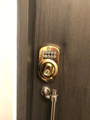 a brass door knob on a wooden door at Great Views Apartment II in Limassol