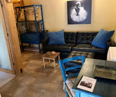 a living room with a couch and a table at Guesthouse Gonia in Pera Orinis