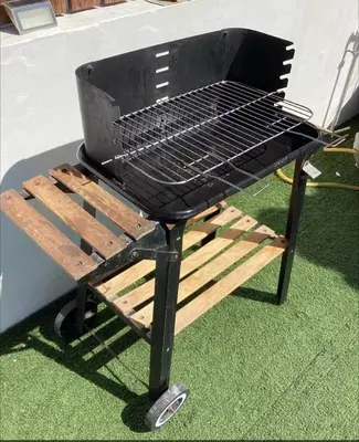 a barbecue grill sitting on top of some grass at Sunny Rooftop in Ayia Napa 91Sqm Terrace Delight! in Ayia Napa