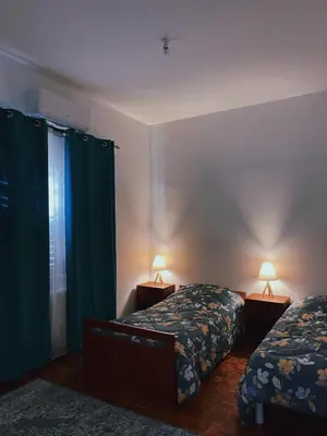 a bedroom with two beds and two lamps in it at Indie7house in Pano Lefkara