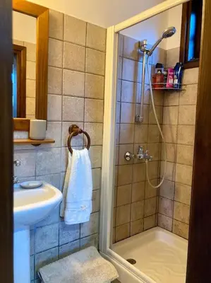a bathroom with a shower and a sink at Traditional House with Mountain View - Dierona Village in Dierona
