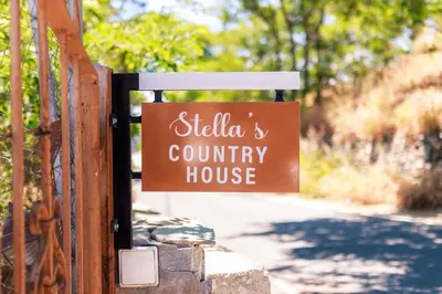 a sign for a silla county house on a gate at Stella's Country House in Prodromos