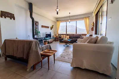 a living room with a couch and a table at Stella's Country House in Prodromos