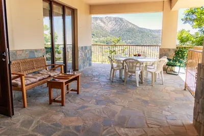 a patio with a table and chairs at Stella's Country House in Prodromos