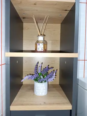 a vase of purple flowers on a shelf in a bathroom at Luxury Apartment No. 202 (Napa Ace) in Ayia Napa