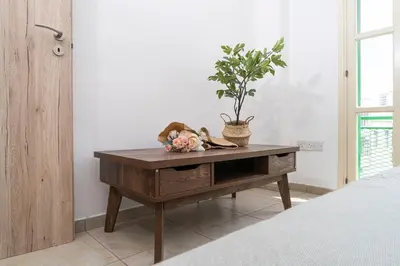 a room with a table with a potted plant on it at Private room in shared flat in Nicosia