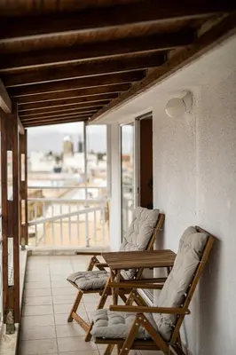 two chairs and a table on a balcony at Sky-view Hideaway in Nicosia