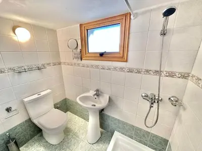 a bathroom with a toilet and a sink and a shower at Lovely Pool Villa in Pyla in Pyla
