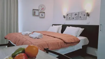 a hotel room with a bed with towels on it at STAY Napa Living Studios in Ayia Napa