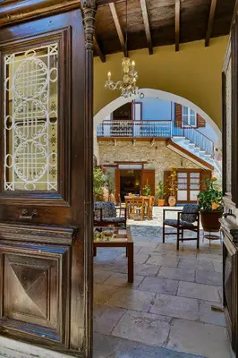 an entry door to a house with a patio at Theodorou Stone House in Pano Lefkara