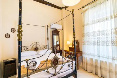 a bedroom with a four poster bed at Theodorou Stone House in Pano Lefkara