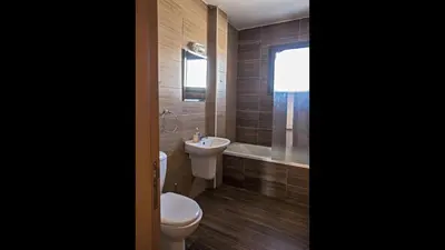 a bathroom with a toilet and a sink at Ayia Napa Holiday Apartment Na101 in Ayia Napa
