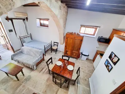 an overhead view of a living room with a table and chairs at Athena's Pool Oasis in Skarinou