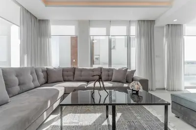 a living room with a couch and a coffee table at Imperial Jade V2 - Villa Semeli in Protaras in Paralimni