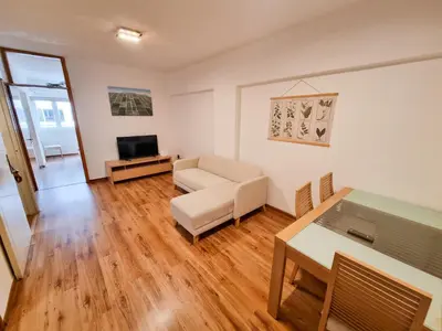 a living room with a couch and a table at CityCenter Apartment in Larnaka