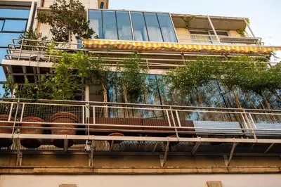 a building with a balcony with plants on it at City Centre Studios in Limassol