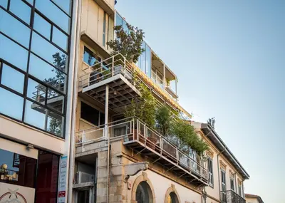 a building with balconies and plants on it at City Centre Studios in Limassol