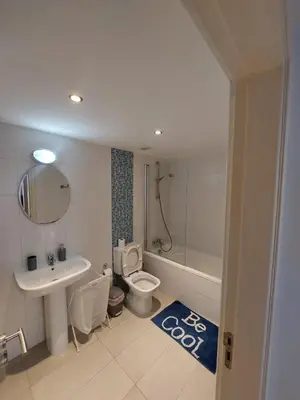 a bathroom with a sink and a toilet and a bath tub at Sunny Breeze in Ayia Napa