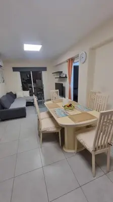 a kitchen and dining room with a table and chairs at Mezzarina apartment ayia napa in Ayia Napa