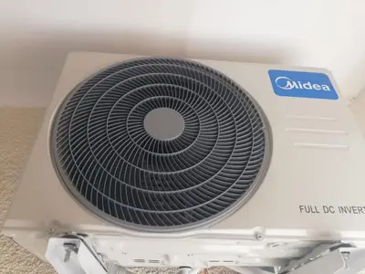 a white fan sitting on top of a box at Cozy studio with terrace, sea views, near beaches and amenities in Ayia Napa