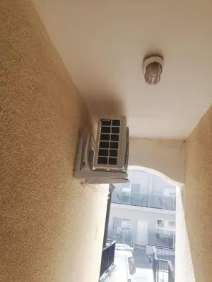 a room with a air conditioner on the side of a wall at Cozy studio with terrace, sea views, near beaches and amenities in Ayia Napa