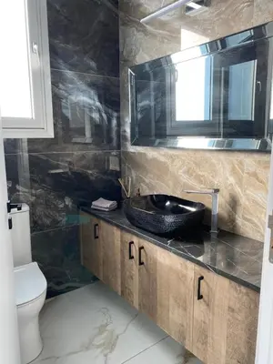 a bathroom with a sink and a toilet at City Lights - Luxury Penthouse - Panoramic view - Near Unic in Nicosia