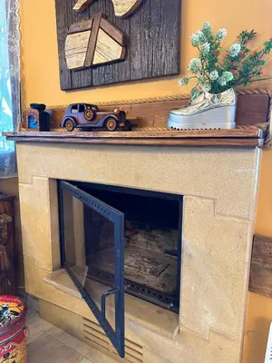 a fireplace with a toy car on top of it at Sotira Agia Napa Luxury House in Ayia Napa