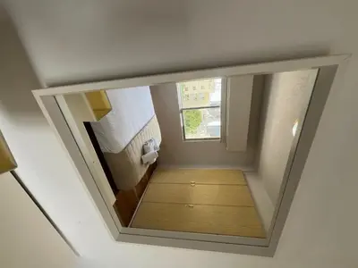 a view of a small room with a mirror at 1BDR Affortable and Cozy Stay in Nicosia - Ioanni Polemi By Platform 357 in Nicosia