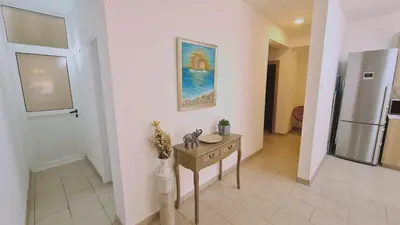 a room with a table and a painting on the wall at STAY Mermaid's Cove in Limassol