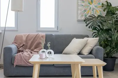 a living room with a couch and a coffee table at Rodoni Residence in Strovolos